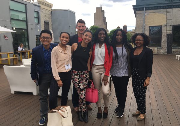 2017 IRTS Summer Fellows posing on the Spotify rooftop with 2013 IRTS alum, Tolu Ayeni